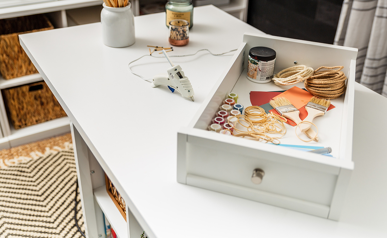 Counter-height craft table with heat-resistant crafting surface