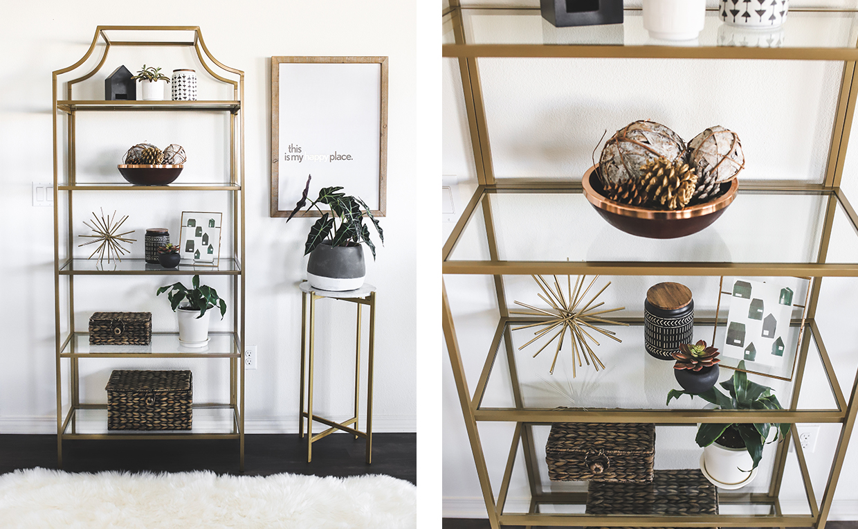 Gold metal and glass tower bookcase in dining room