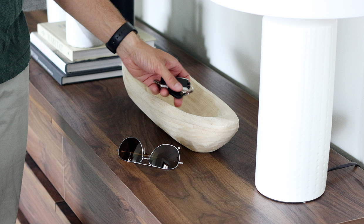 Keys, glasses, wood bowl and dresser