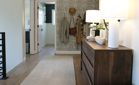 Main entryway, hallway with dresser and bookshelf